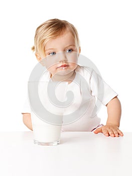 Little girl drinks milk