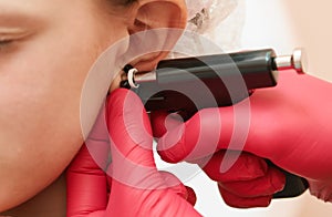 little girl during an ear piercing