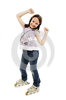 Little girl with earphones in roller skates