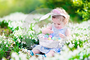 Little girl on Easter egg hunt