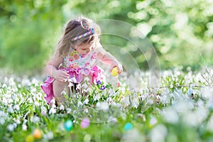 Little girl on Easter egg hunt