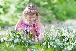 Little girl on Easter egg hunt