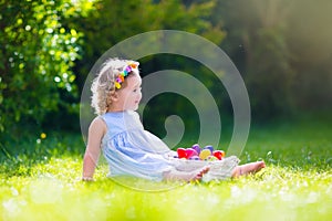 Little girl on Easter egg hunt