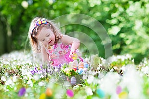 Little girl on Easter egg hunt