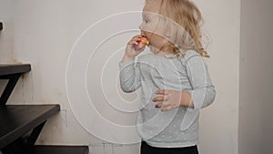 Little girl eating an Apple