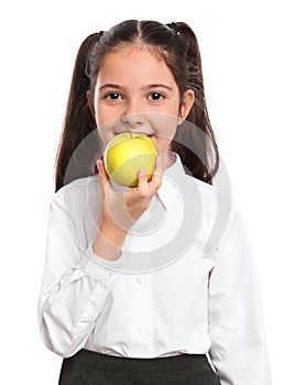 Little girl eating apple on white. Healthy food for school lunch