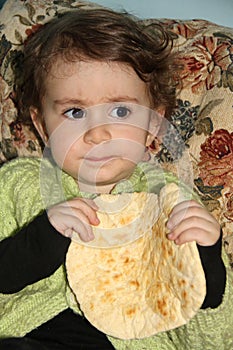 Little girl eating banana