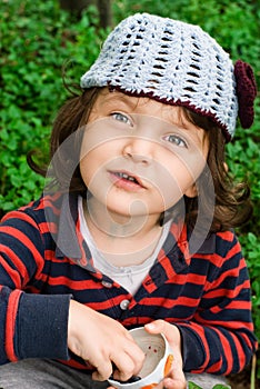 Little girl eating blueberries