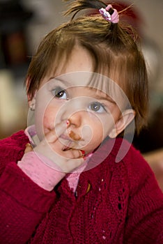 Little girl eating chocolate