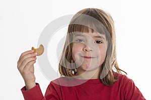 Little girl eating a cookie