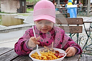 Little girl eating french fry