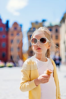 Little girl eating ice cream