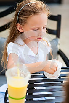 Little girl eating ice cream