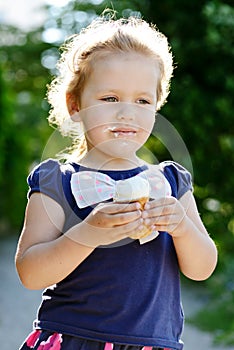 Little girl eating ice-cream