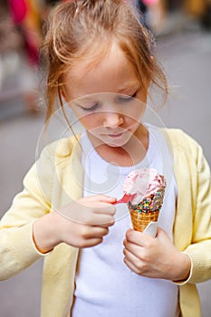 Little girl eating ice cream