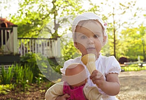 Little Girl Eating Ice-cream Outdoor photo