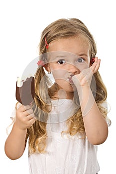 Little girl eating icecream licking fingers