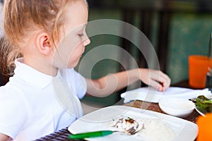 Little girl eating lunch