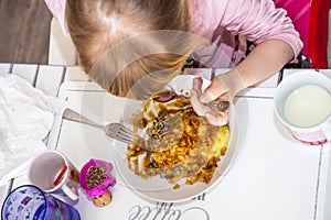 Little girl eating mashed potatoe