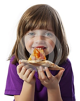 A little girl eating a pizza