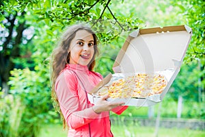 Little girl eating pizza. pizza delivery. unhealthy and healthy food. happy childhood. child feel hunger. hungry kid