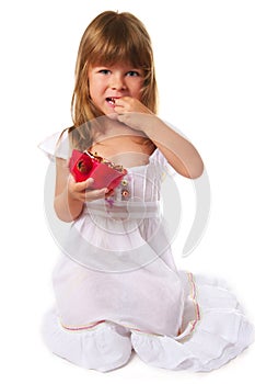 Little girl eating pomegranate