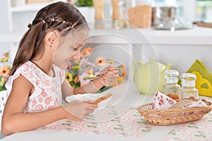 Little girl eating soup