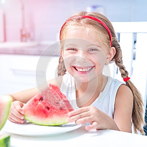 Little girl eating watermelon