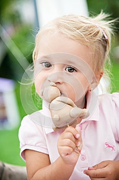 little girl eats cake