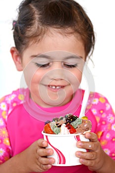 Little girl eats ice cream