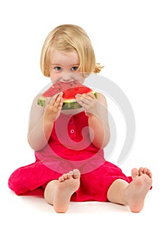 Little girl eats melon