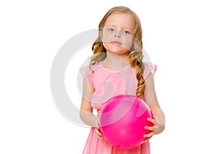 Little girl is engaged in fitness with a ball.