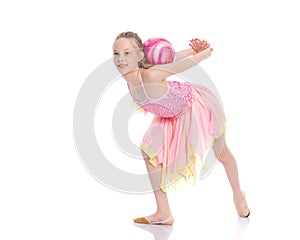 Little girl is engaged in fitness with a ball.