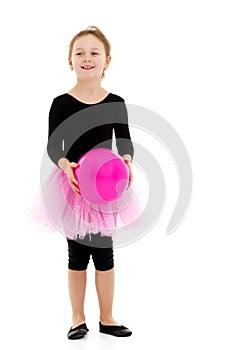 Little girl is engaged in fitness with a ball.