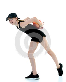 Little girl is engaged in fitness with a ball.