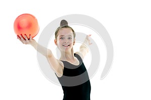 Little girl is engaged in fitness with a ball.