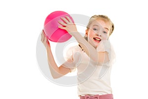 Little girl is engaged in fitness with a ball.