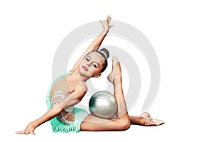 Little girl is engaged in rhythmic gymnastics with ball isolated on white.