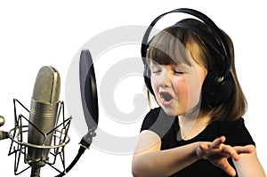 Little girl engrossed in singing photo