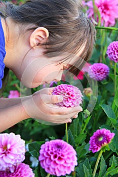 Little girl enjoy with flowers