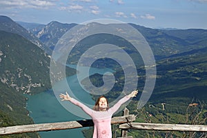 Little girl enjoy in nature on mountain
