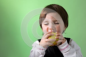 Little girl enjoying apple