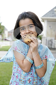 Little girl enjoying cookie