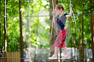 Little girl enjoying her time in adventure park