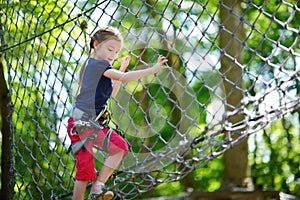 Little girl enjoying her time in adventure park