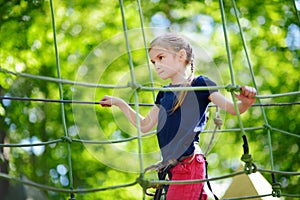 Little girl enjoying her time in adventure park