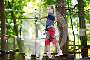 Little girl enjoying her time in adventure park