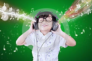 Little girl enjoys the music melody photo