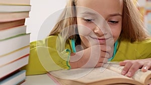 Little girl enjoys reading her book