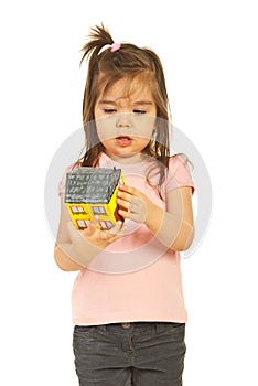 Little girl examine house